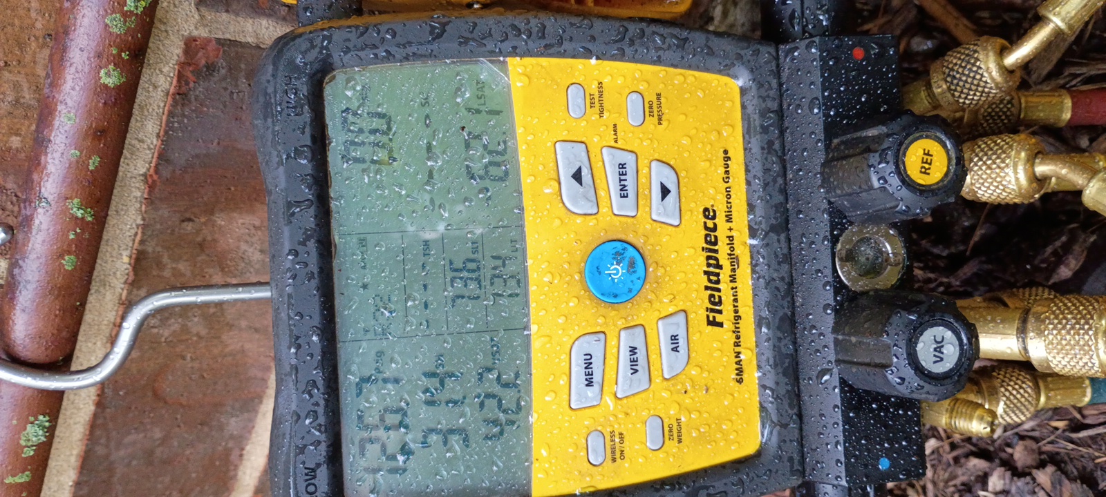 Professional HVAC diagnostic equipment used during a Titan service visit